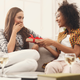 Laura was very surprised when Keisha presented her with a seasoning variety pack.